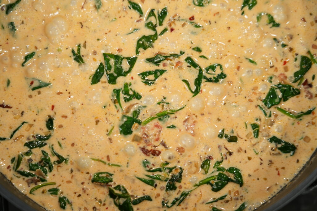 Salmon cream sauce with spinach mixed in along