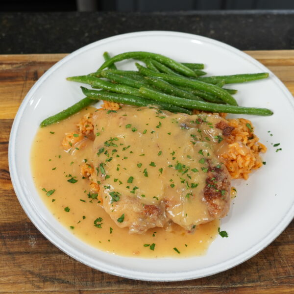Smothered Chicken paired with green beans smothered with homemade brown gravy
