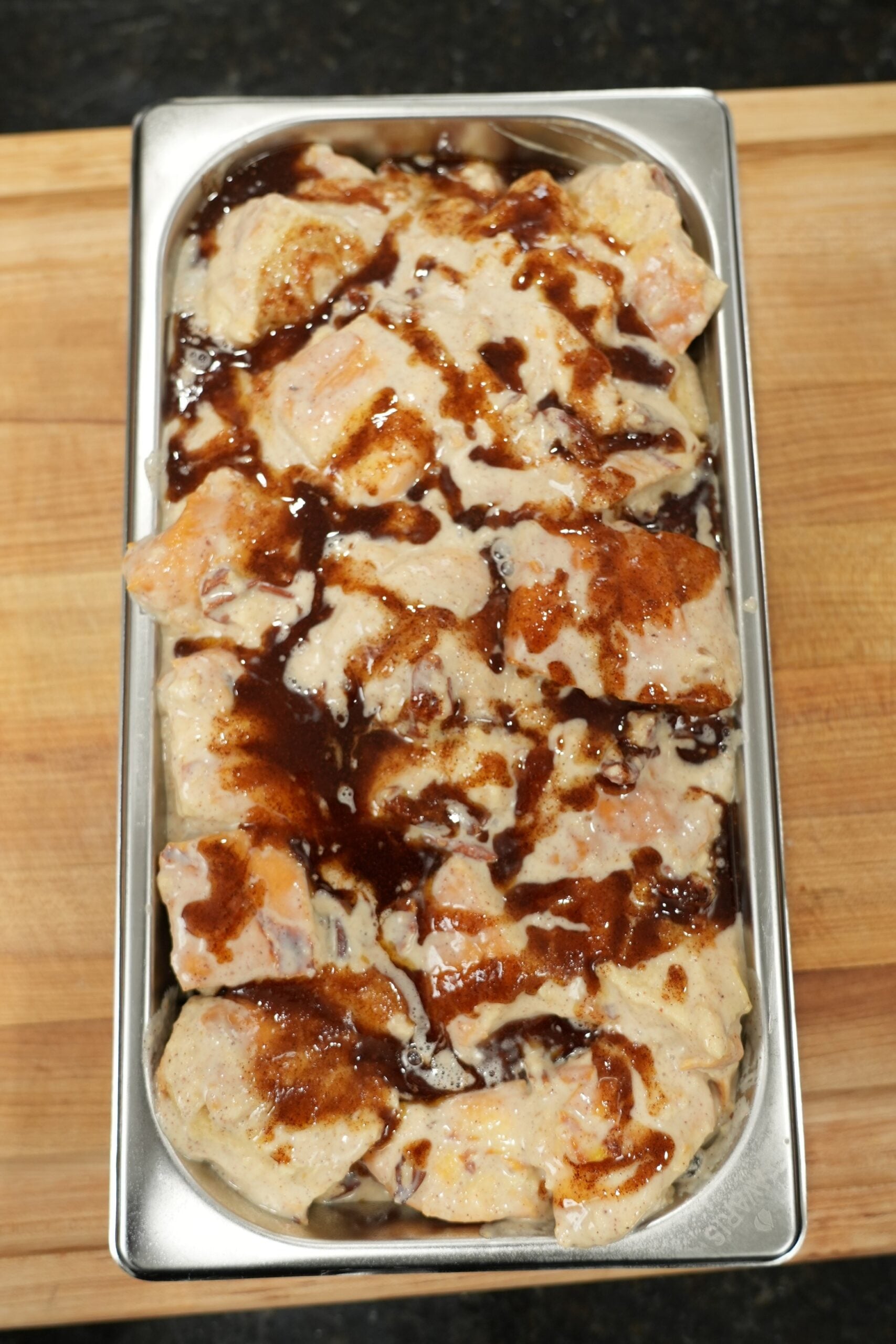 Slice of cinnamon roll bread pudding served on a plate