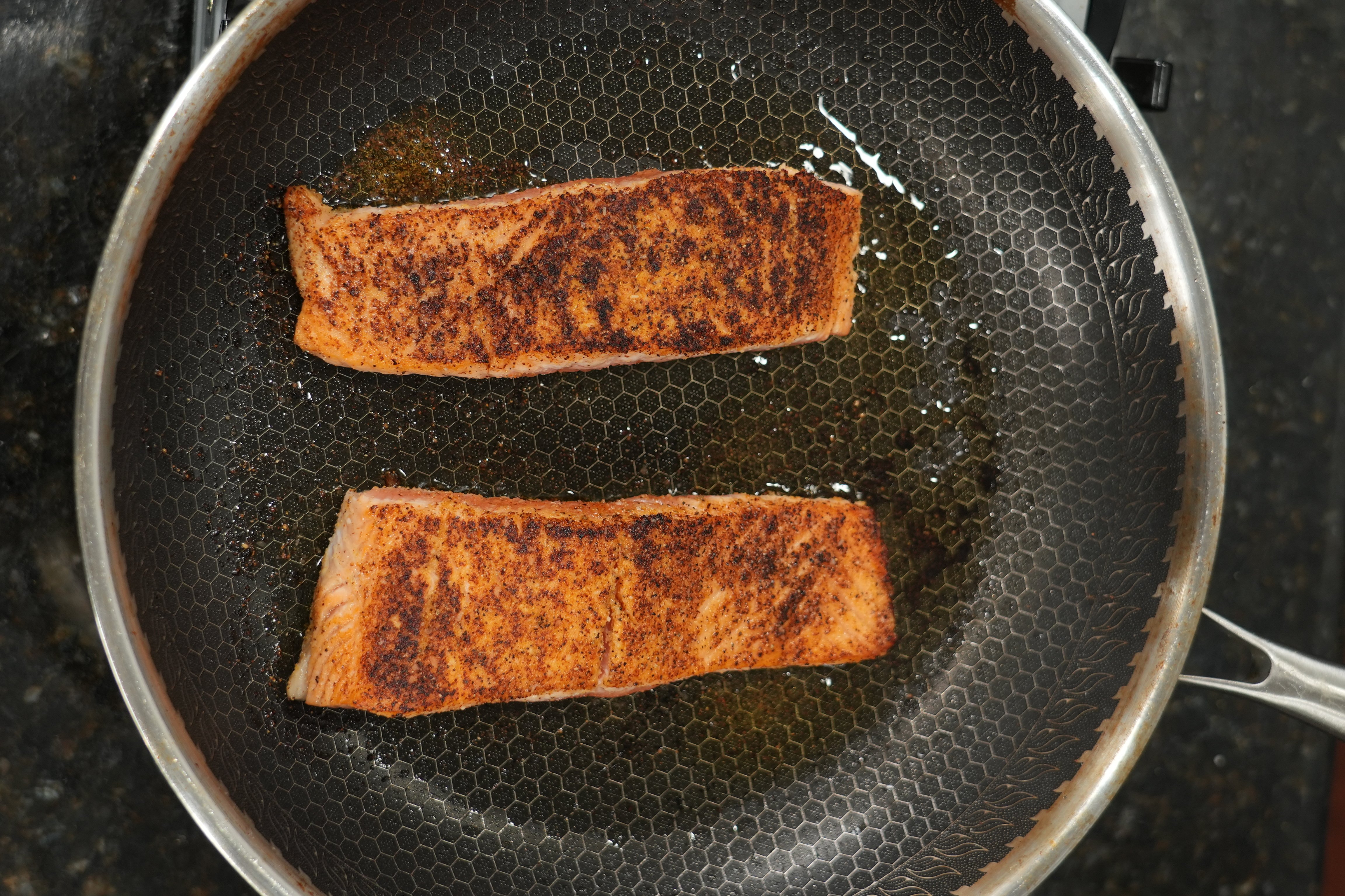 Close up of caramelized onion salmon pasta showing creamy sauce texture