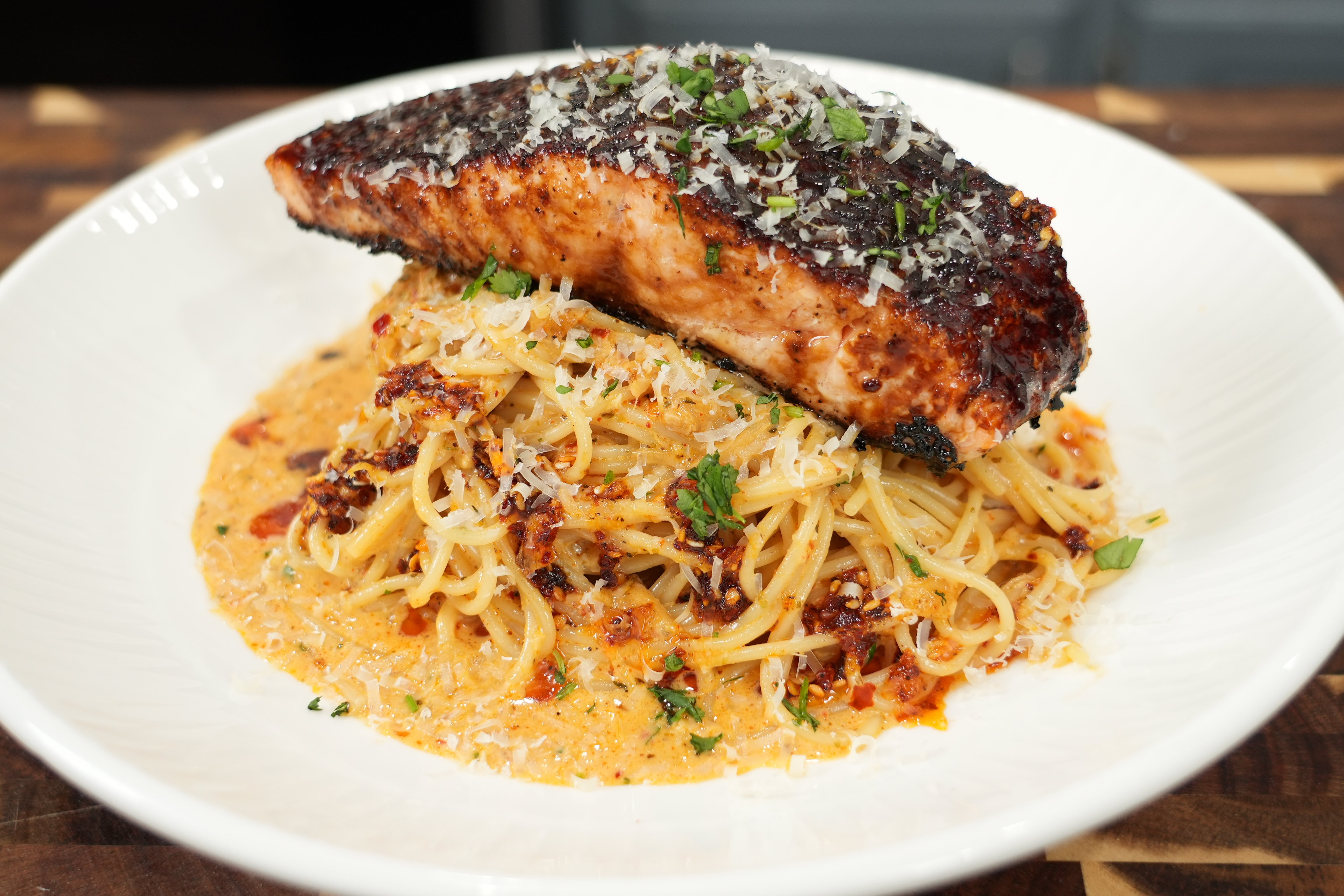 Final plated caramelized onion salmon pasta ready to serve