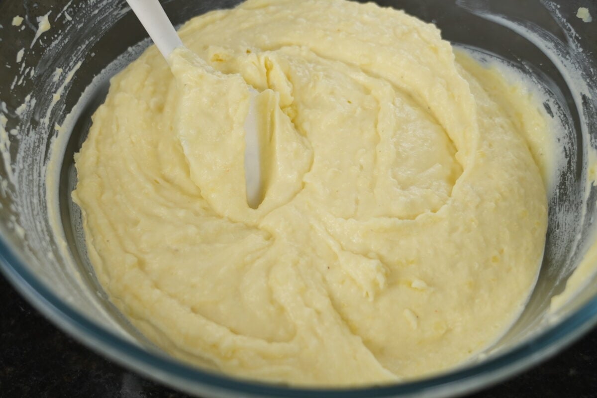 Creamy mashed potatoes being stirred in a pot for shepherd's pie topping
