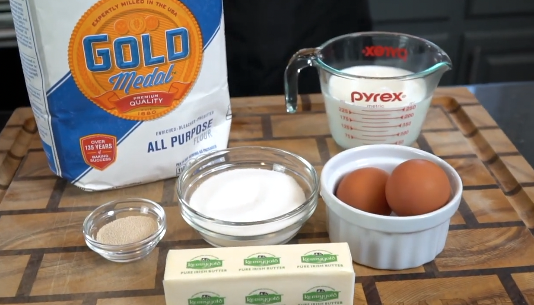 Cinnamon roll dough rising in bowl