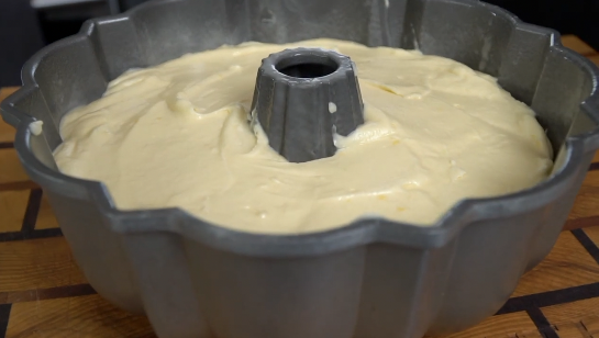 Golden baked lemon pound cake cooling in Bundt pan