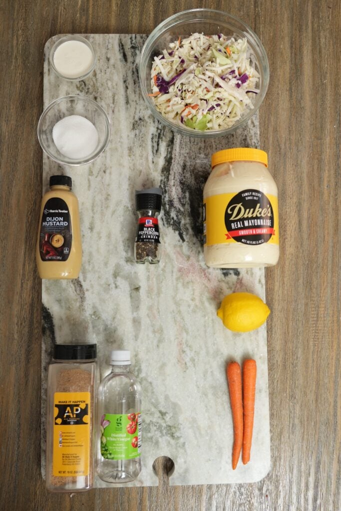 ingredients for southern style coleslaw with cabbage carrots and mayo