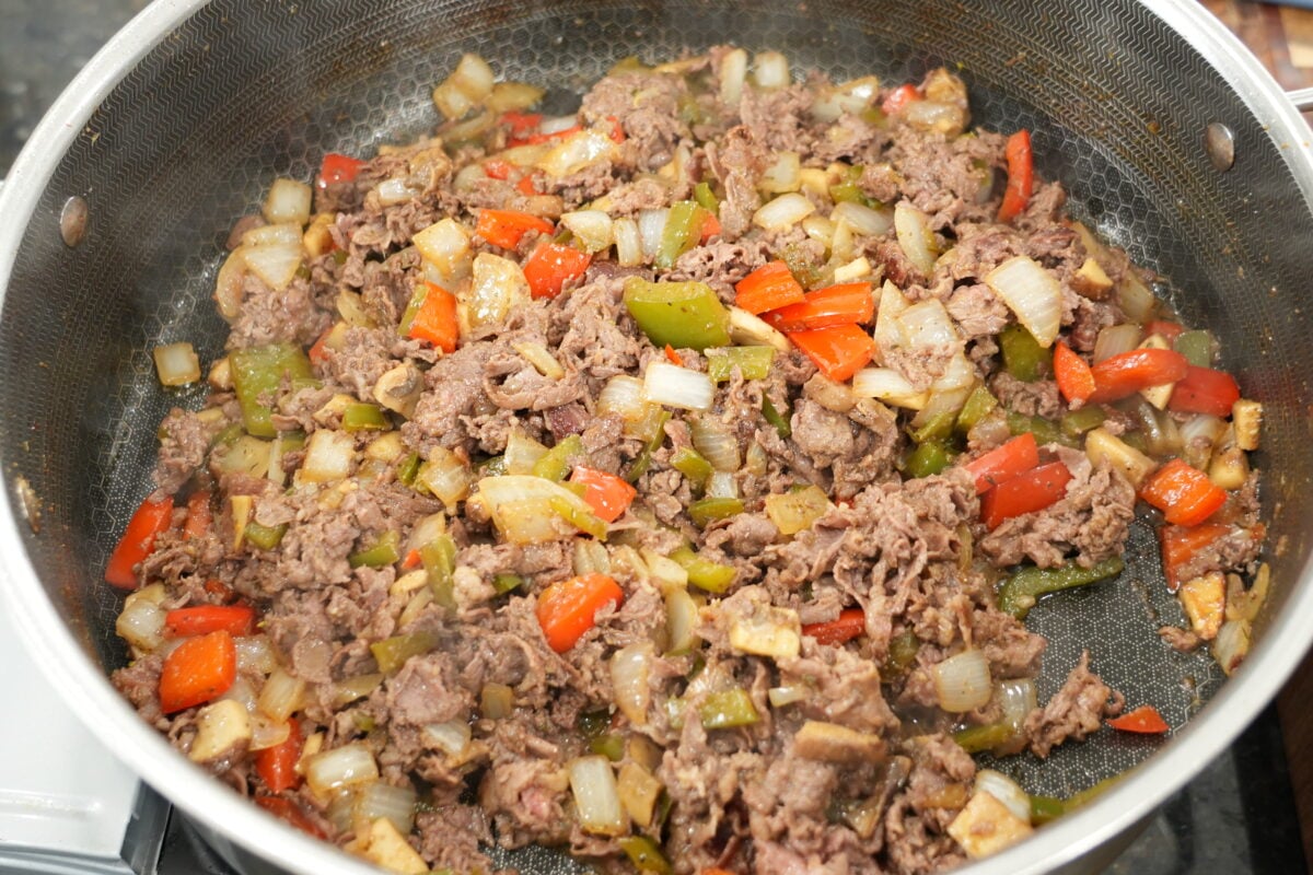 shaved ribeye steak with melted Cooper Sharp cheese