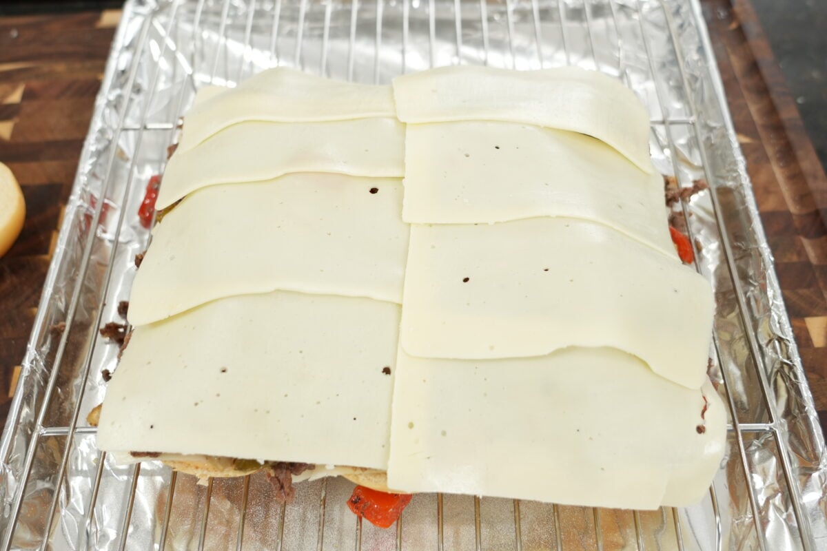 slider buns topped with golden garlic butter before baking