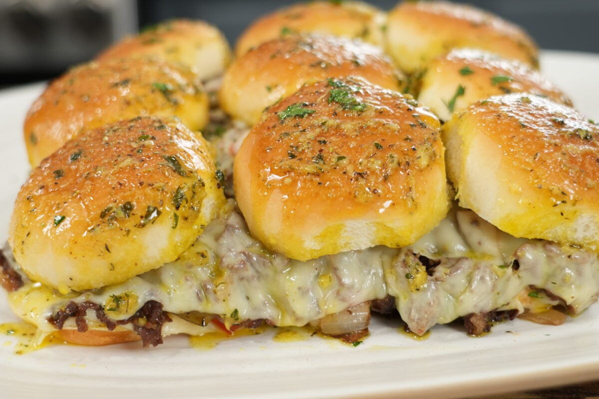 finished cheesesteak sliders served with honey dijonnaise sauce