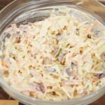 southern style coleslaw in a bowl with creamy dressing