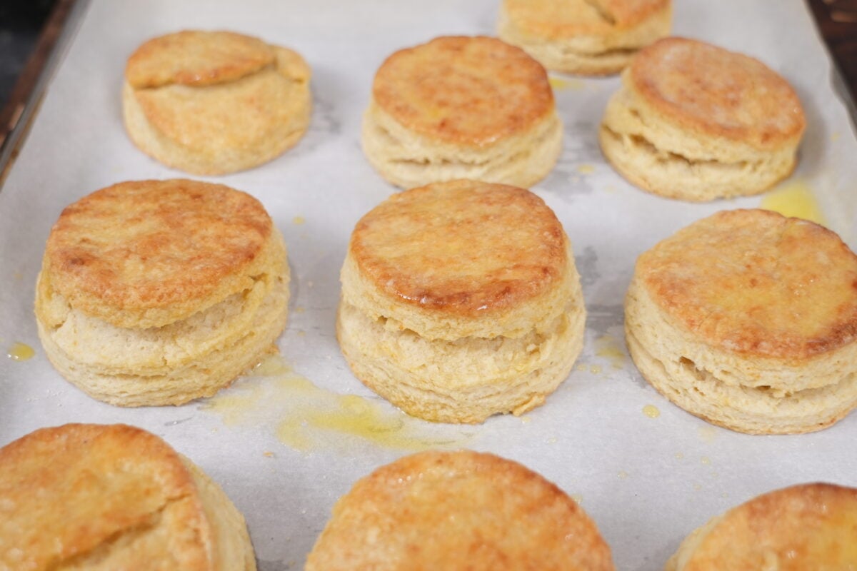 Tall, golden biscuits fresh from the oven, brushed with butter