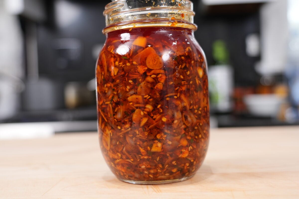 Close-up of crispy homemade chili garlic crunch on a spoon