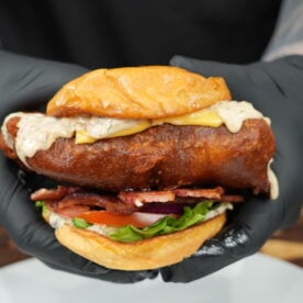 Beer battered fish sandwich cut in half showing the crispy cod