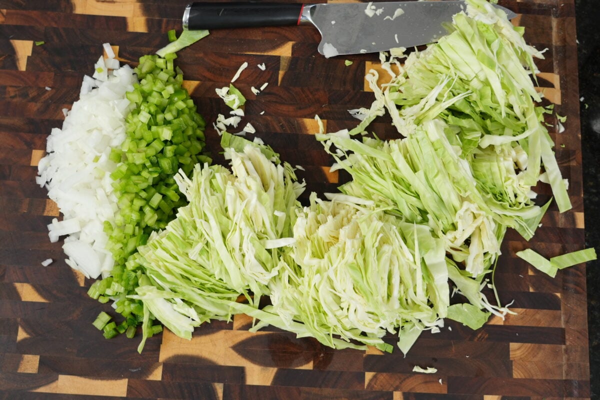 A serving of dirty cabbage with andouille sausage, ground beef, and the Cajun holy trinity