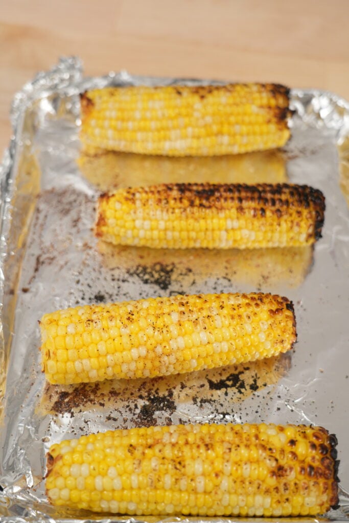 Charring corn in a cast-iron skillet until blackened