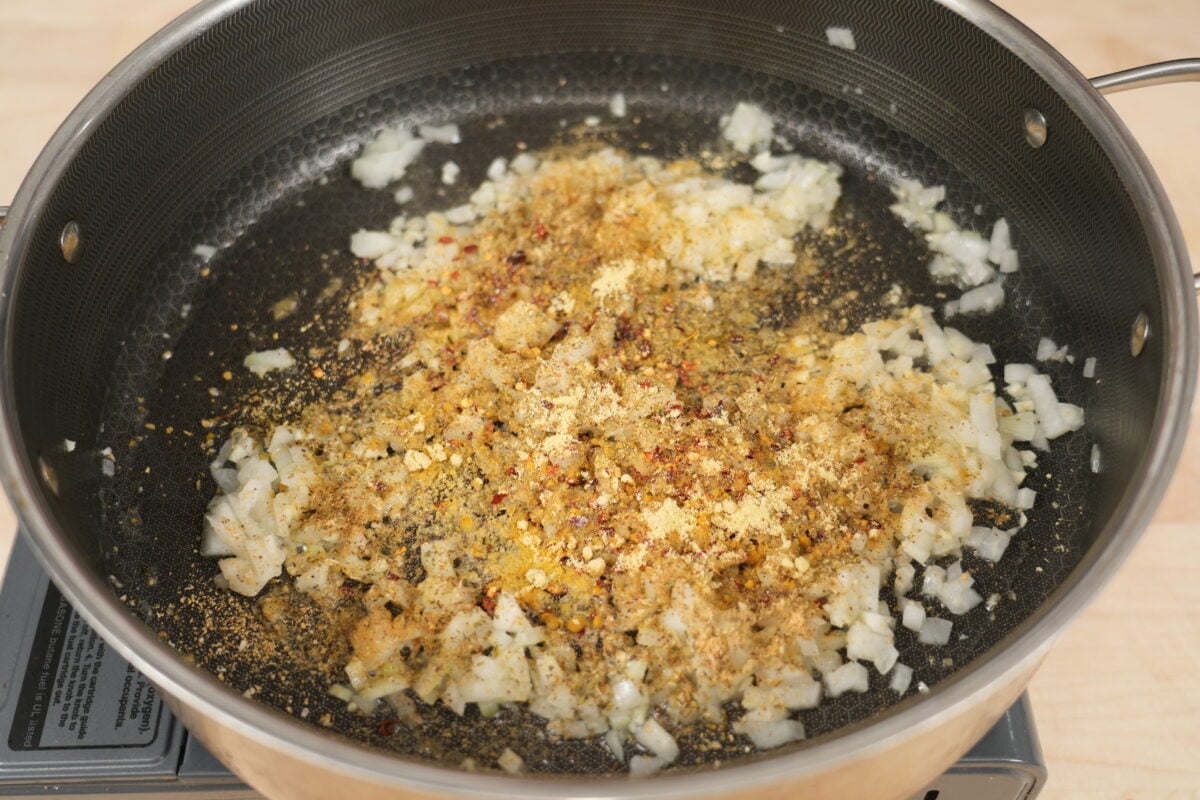 The shrimp and lump crab filling mixed with cheese in a bowl