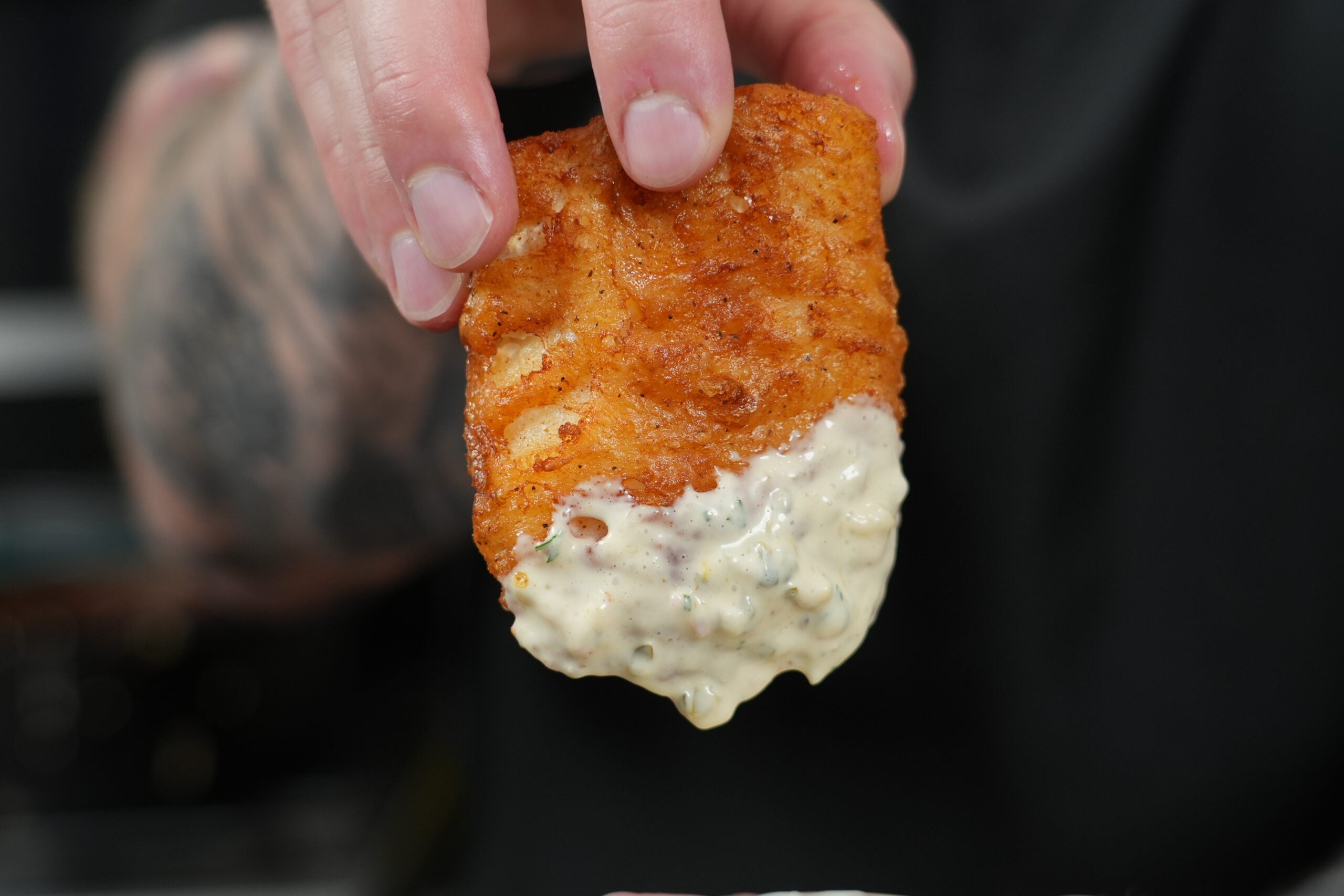 Beer battered fish dipped in homemade tartar sauce