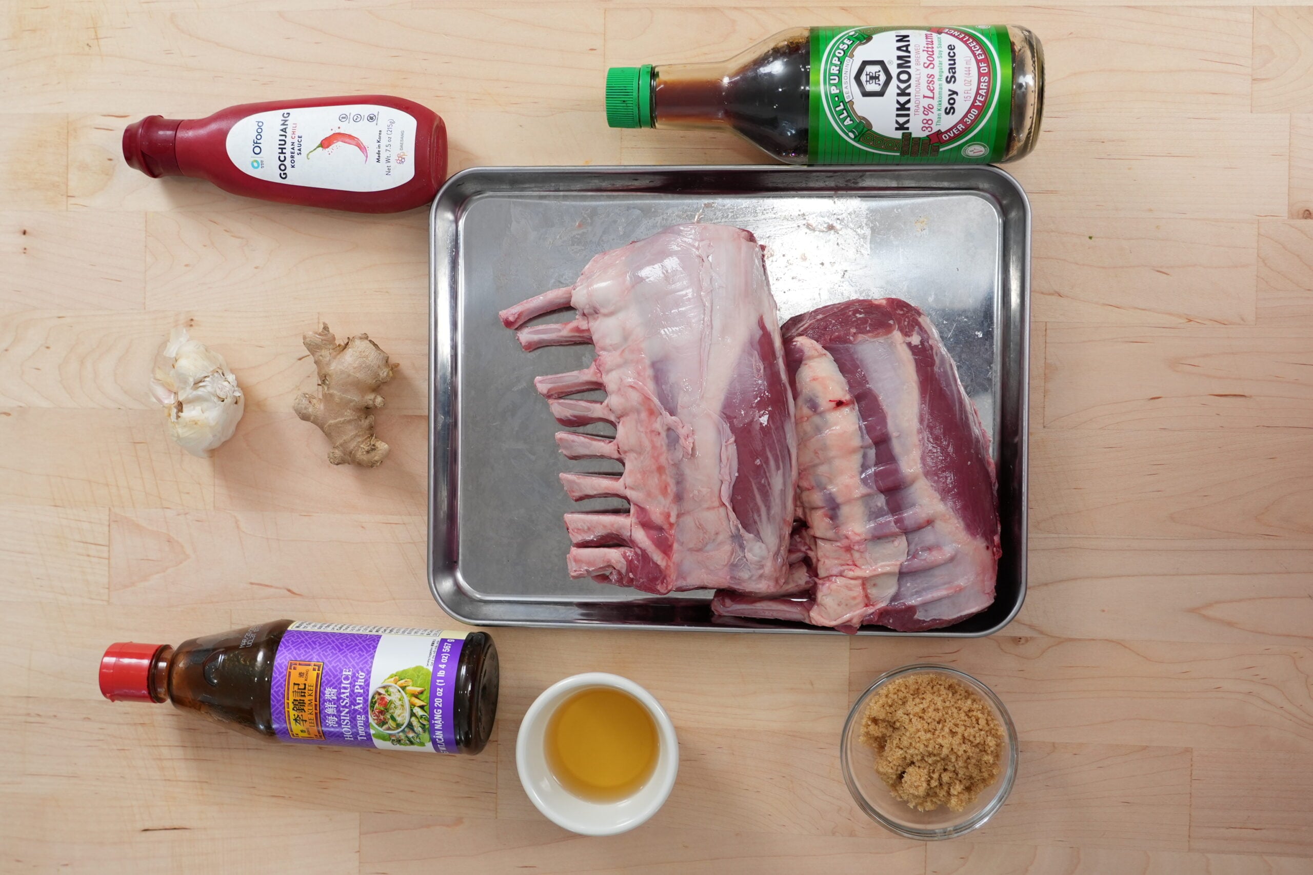 Ingredients for sticky Asian glazed lamb chops arranged on a board