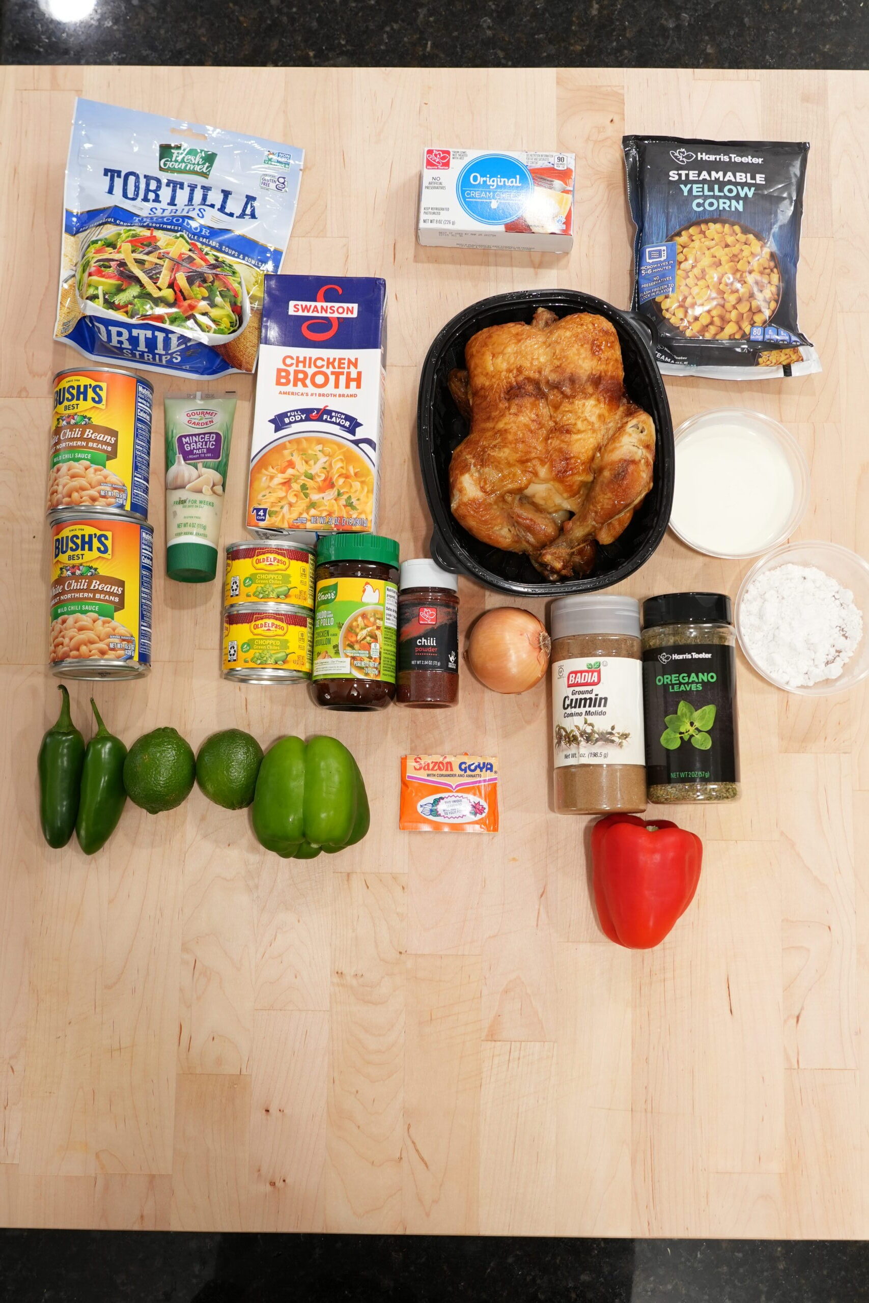 Ingredients for white chicken chili: rotisserie chicken, white beans, green chiles, corn, peppers, broth, cream cheese and spices