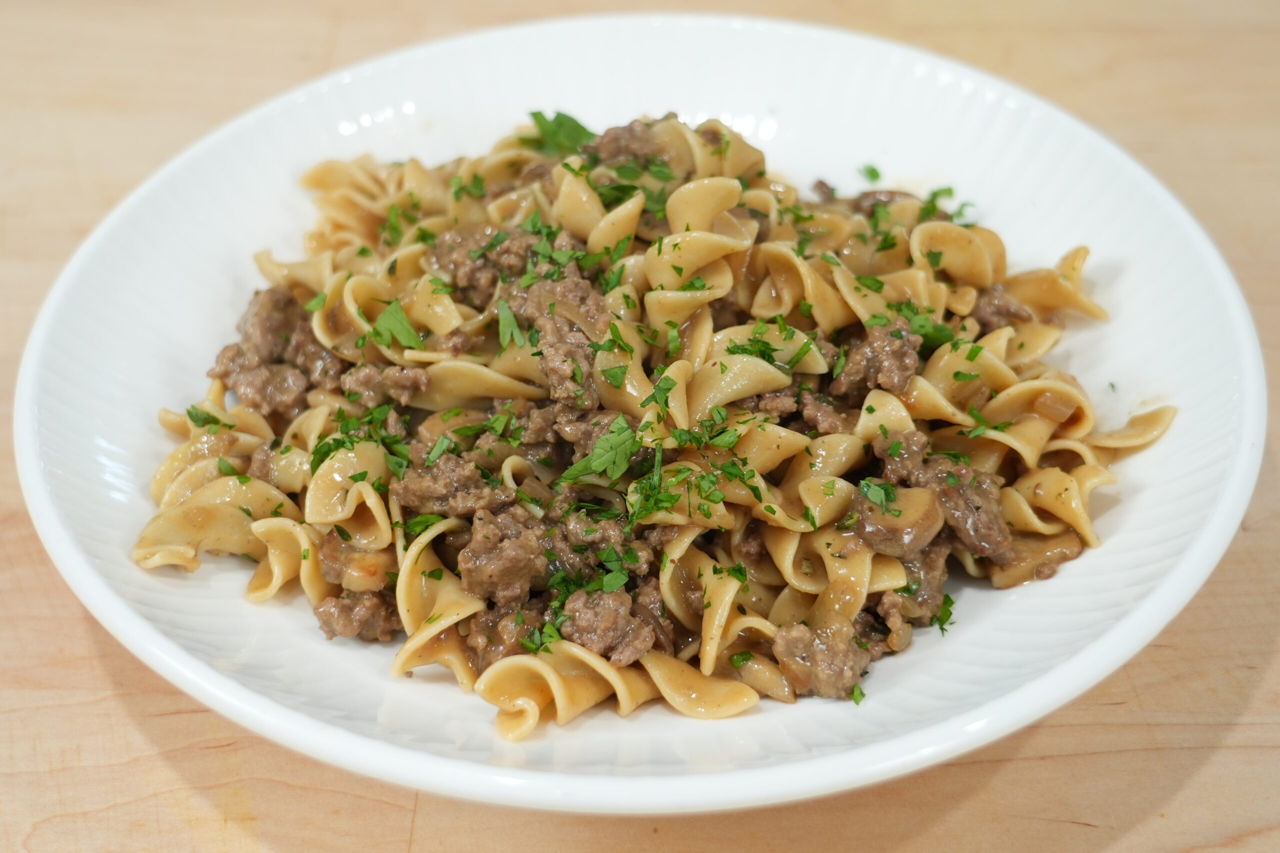 Ground beef stroganoff with mushrooms and noodles ready to serve