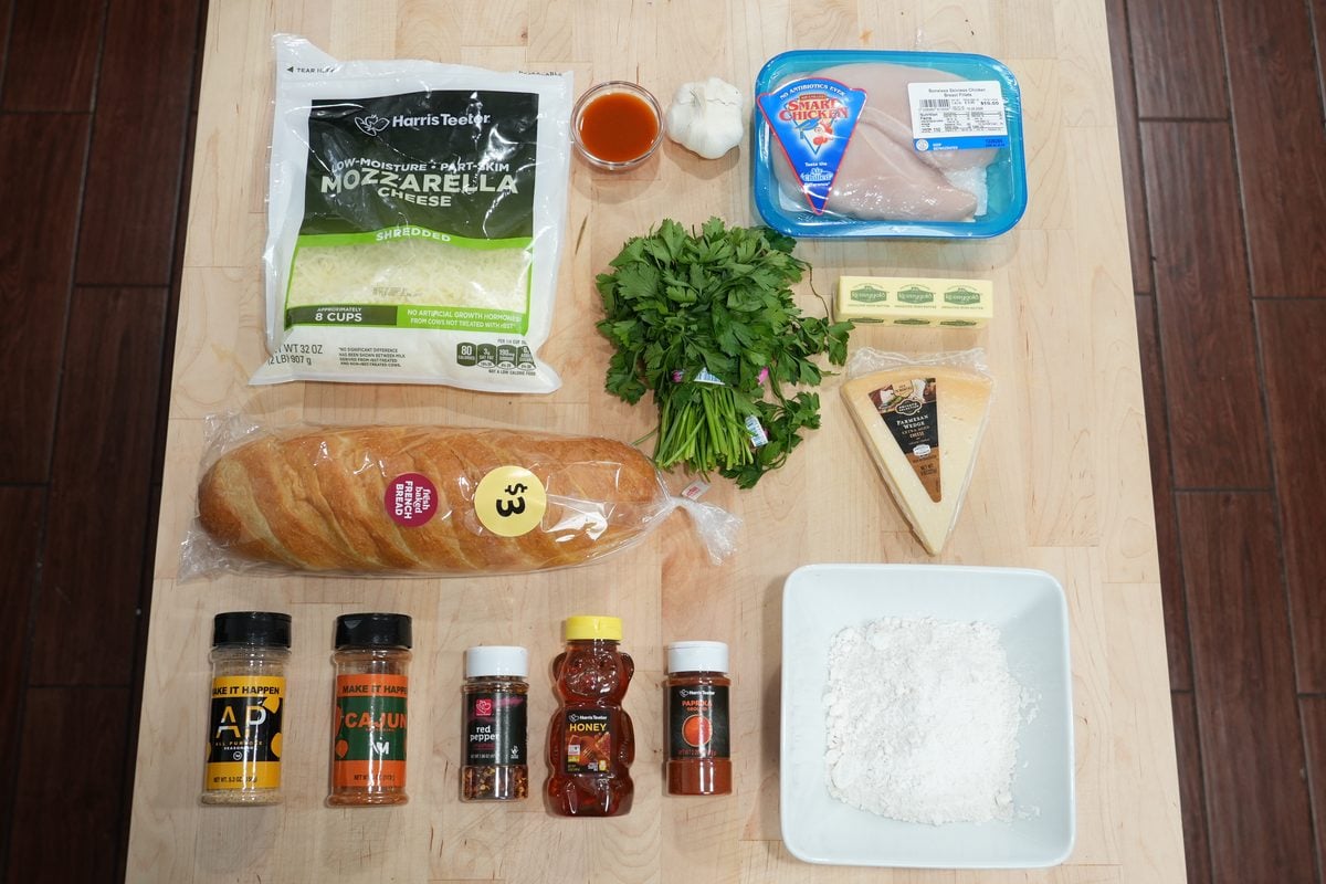 Ingredients for hot honey chicken garlic bread, including chicken, panko, mozzarella, garlic butter and honey